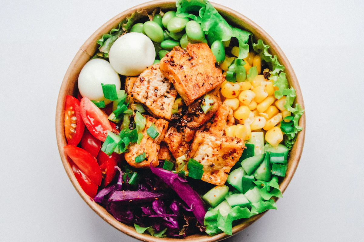 Colourful vegetable bowl with egg and grains